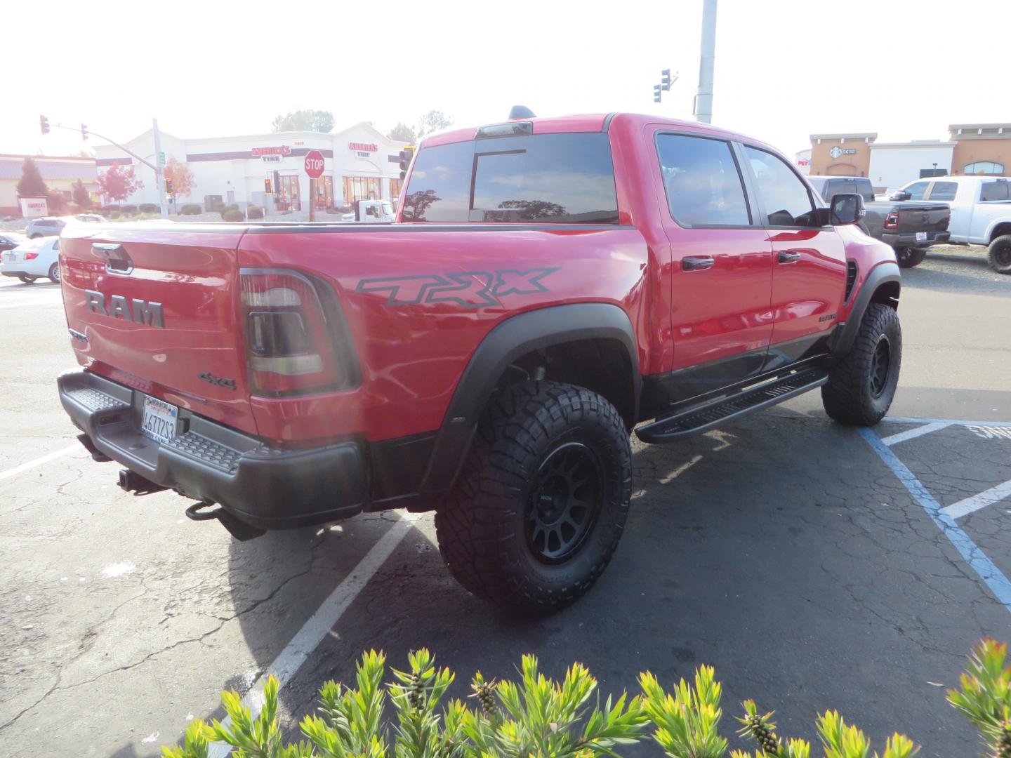 2023 Red /BLACK RAM 1500 Ram 1500 TRX Crew Cab 4x4 (1C6SRFU9XPN) with an 6.2L Supercharged HEMI V8 SRT engine, 8 Speed Auto 8HP95 transmission, located at 2630 Grass Valley Highway, Auburn, CA, 95603, (530) 508-5100, 38.937893, -121.095482 - Must see TRX featuring Eibach front and rear springs, 18" Method NV double black wheels, 37" Nitto Ridge Grappler tires, and window tint. - Photo#5